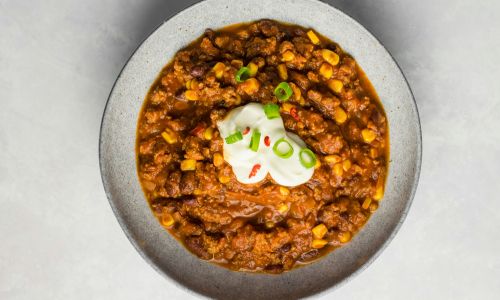 bowl of veggie chilli with sour cream