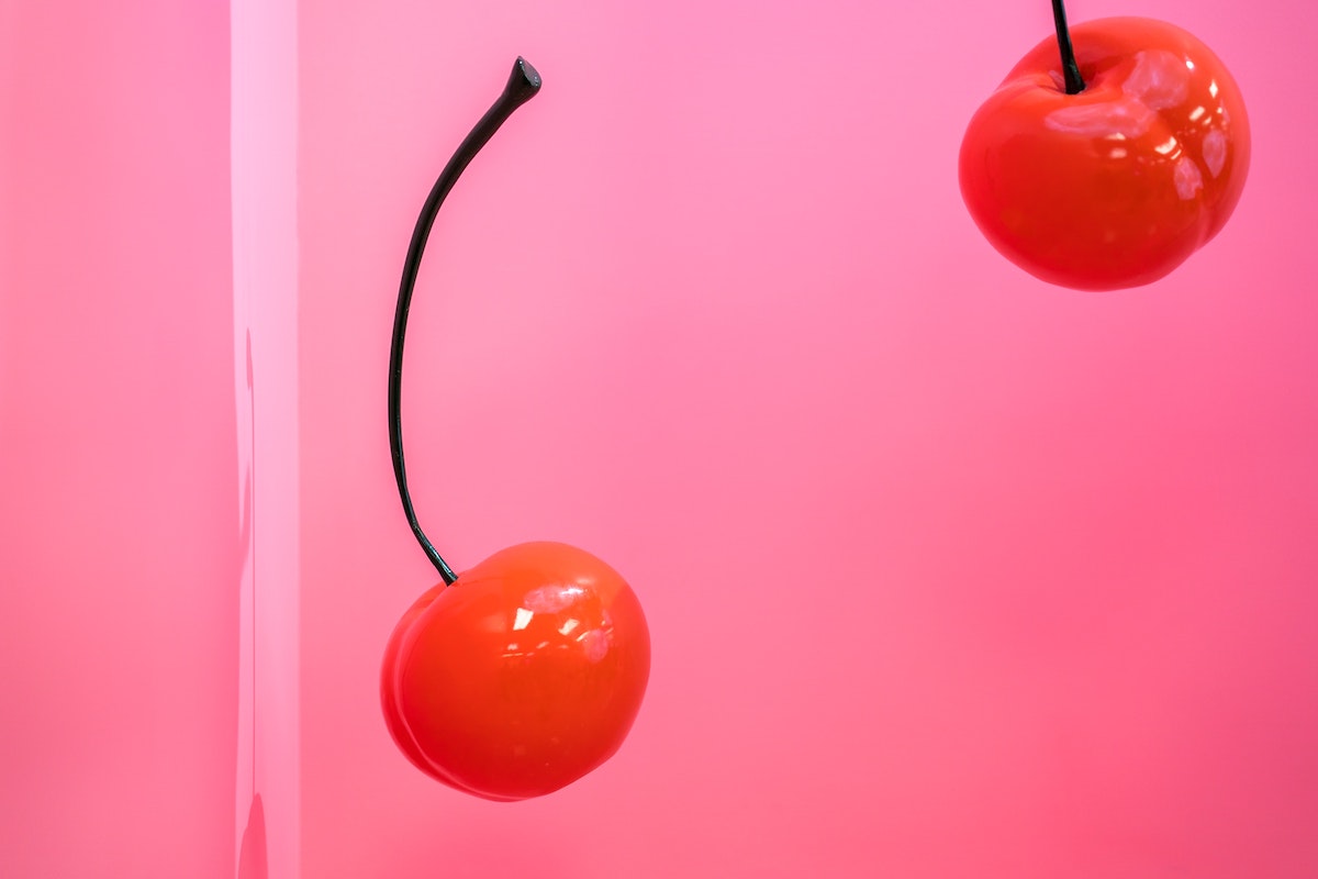 cherries on pink background
