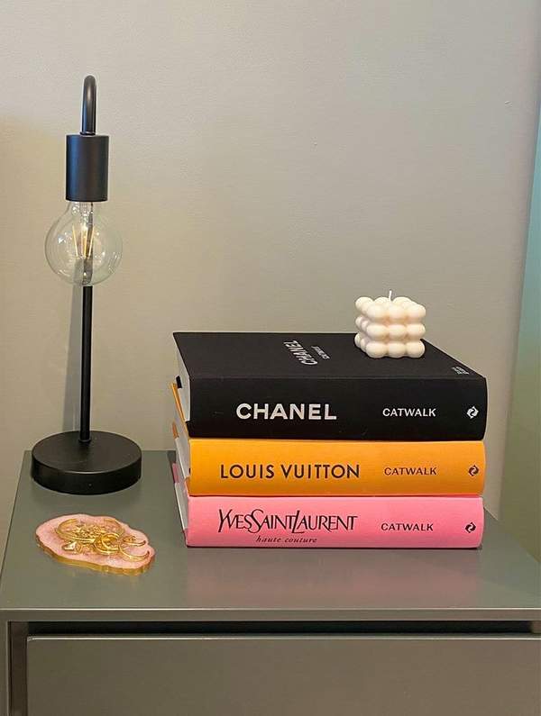 coffee table books on table with lamp - gifts for uni students