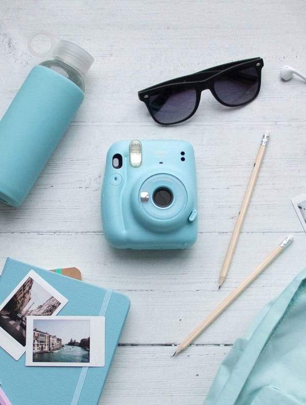 Baby blue coloured poloroid camera. Gifts for university students