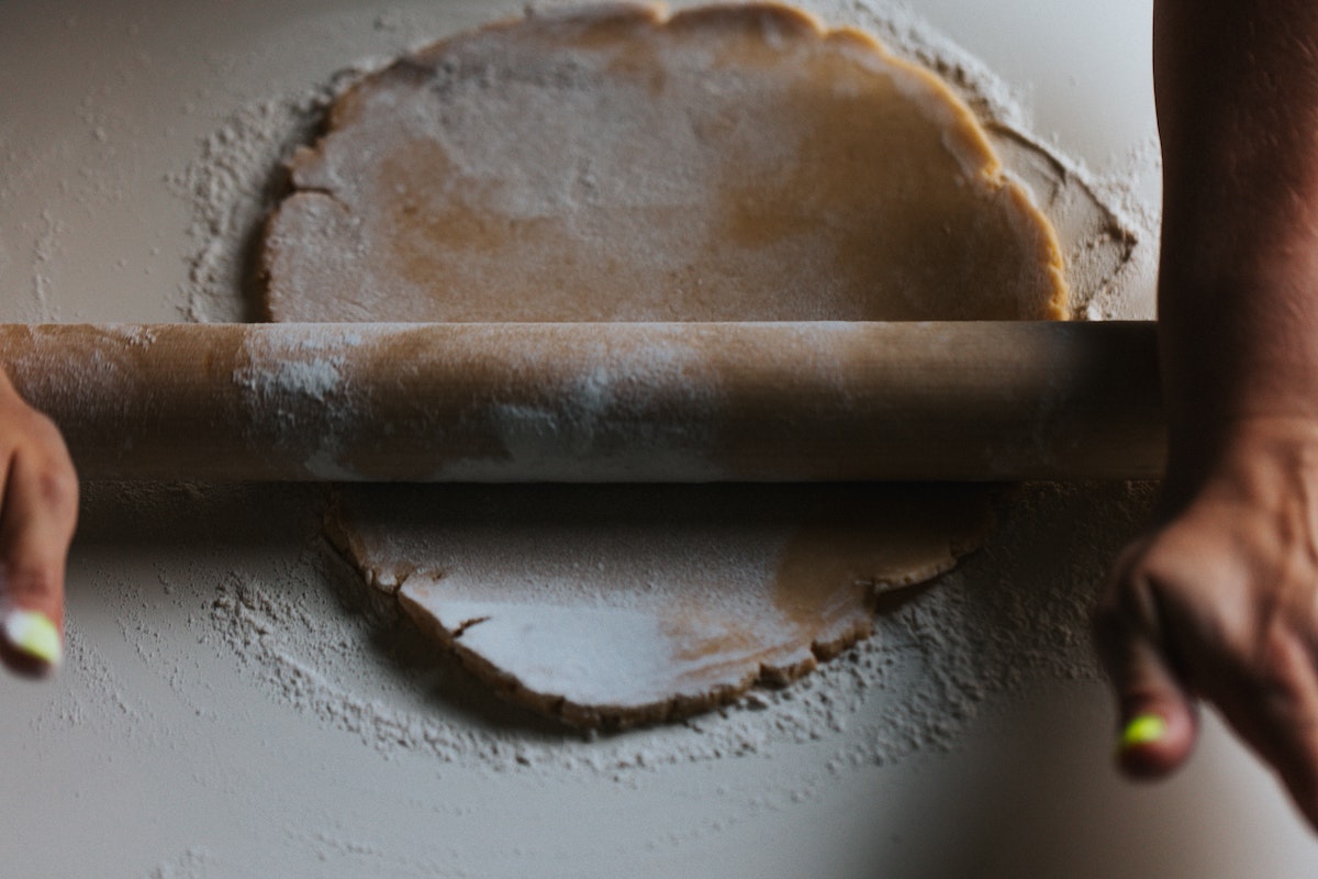 Chicken and onion pie rolling out pastry