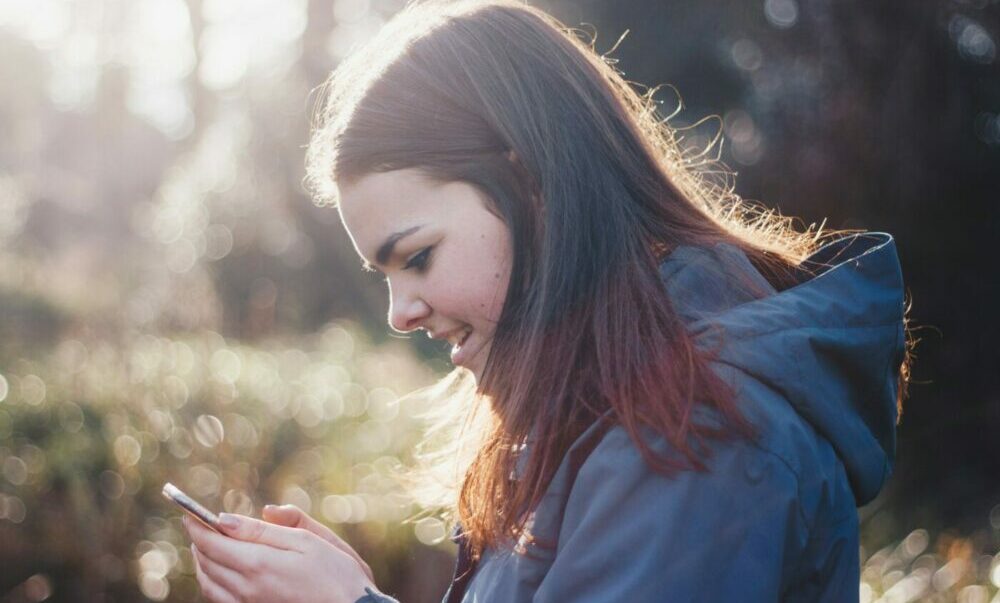 Girl checking GCSE exam results on her phone