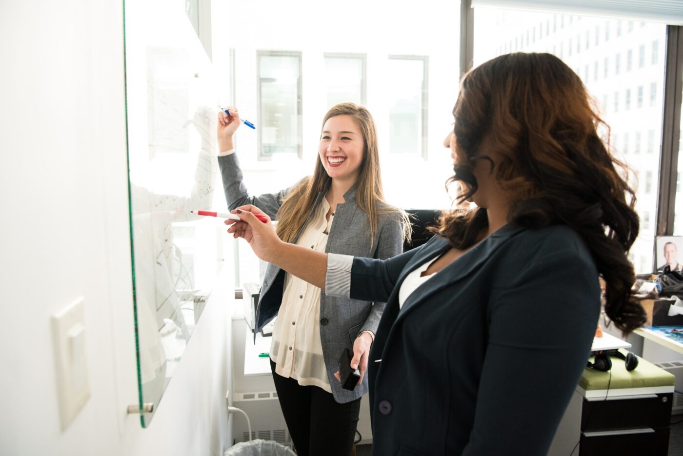 students writing on whiteboard -  minimum maintenance loan