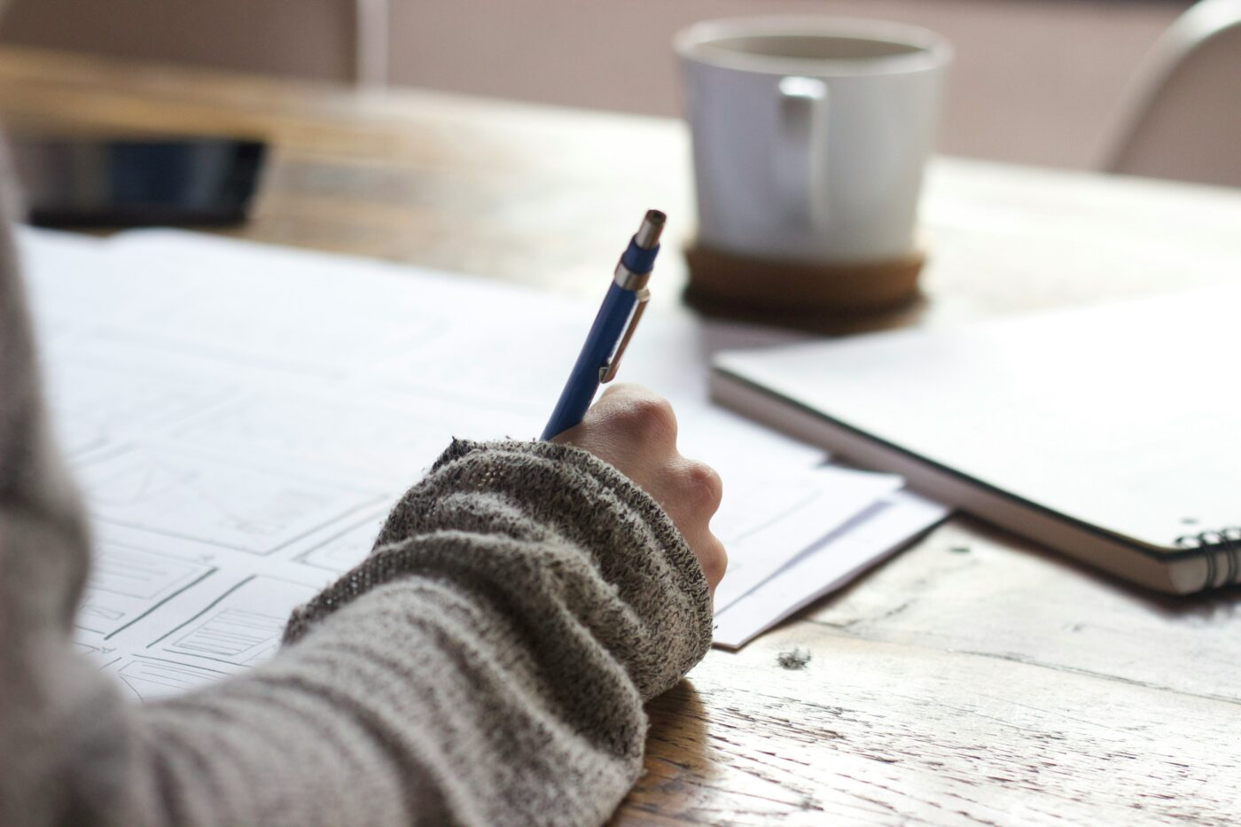 Person writing an application form